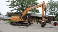 Excavator scores the parking lot